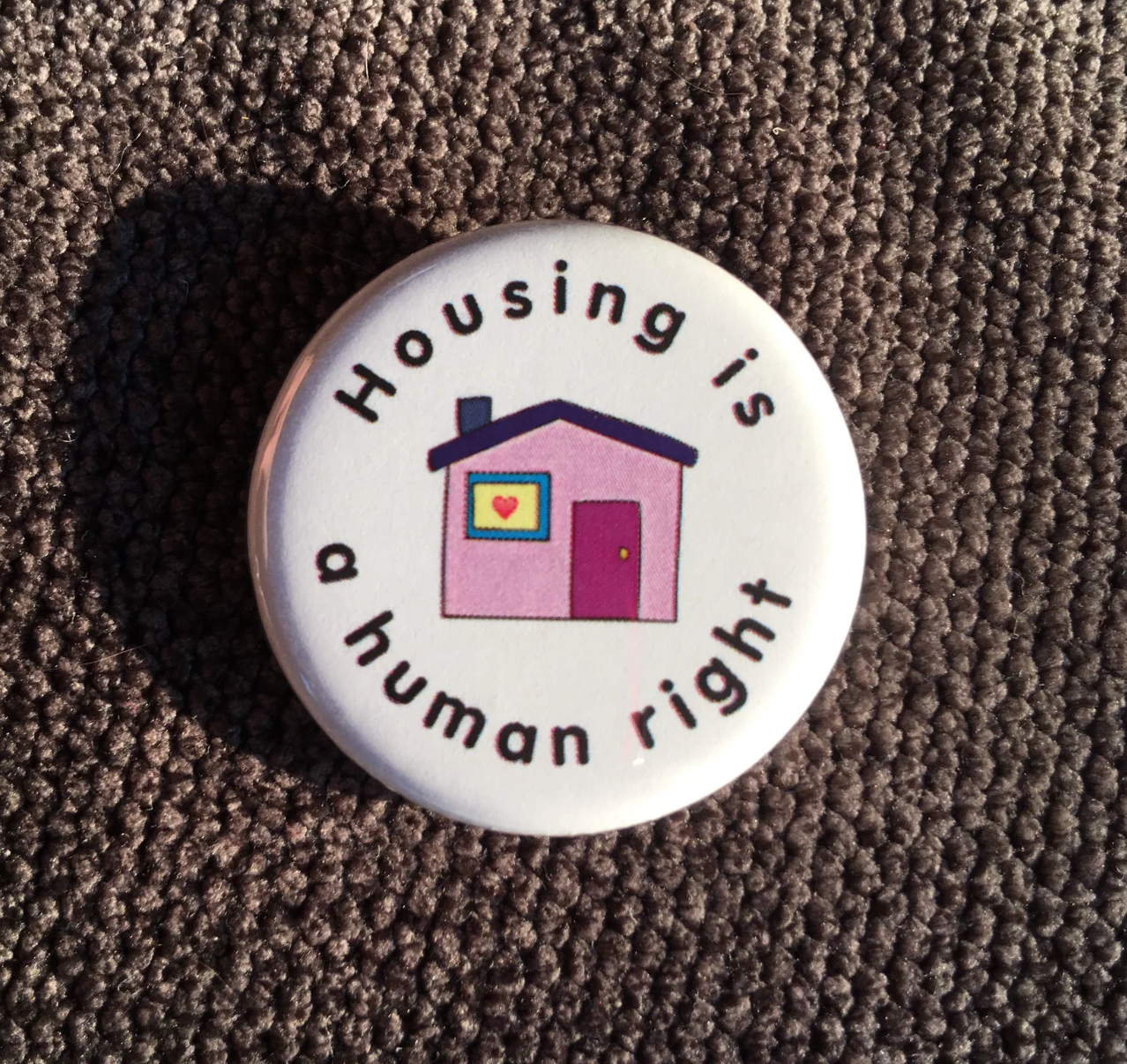 Housing is a human right, Social justice button