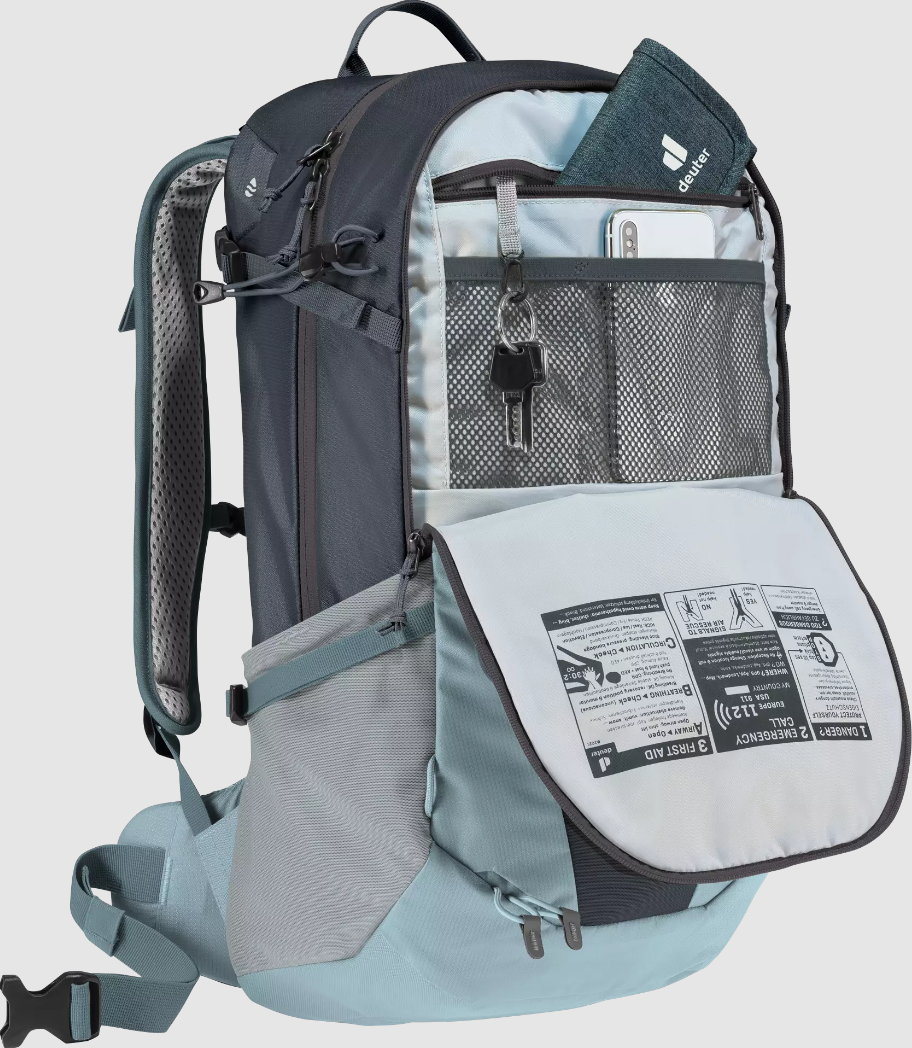 Front view of Deuter Futura 23 Hiking Backpack with front pocket unzipped, demonstrating interior details including mesh pockets and keyring clasp.